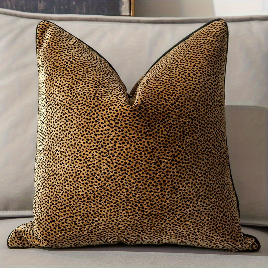 Leopard print pillow on a gray sofa